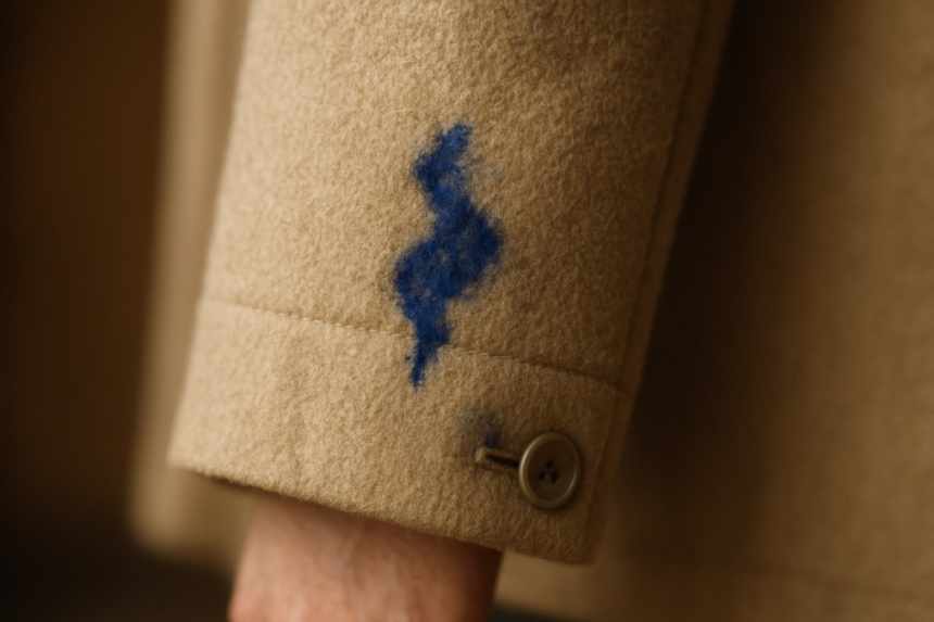 Coat sleeve with ink stain