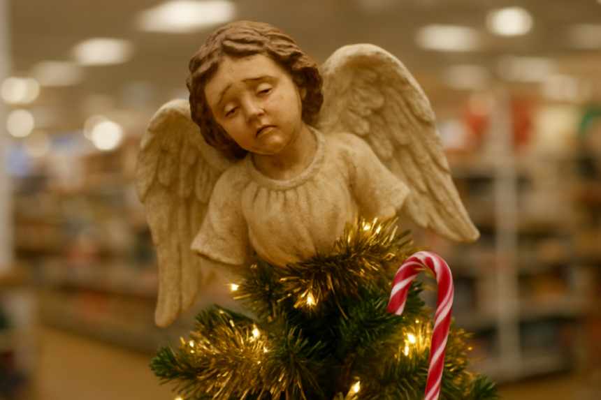 Tired angel tree topper